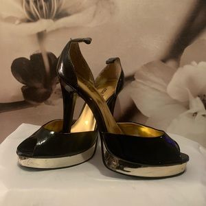 Black and gold platform heels